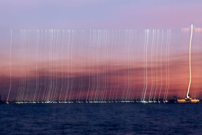 Scenic view of sea against sky at night