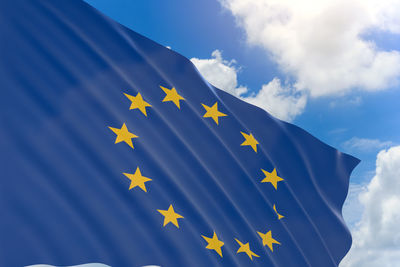 Close-up of flag against blue sky