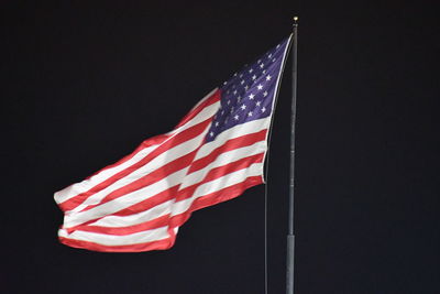 Low angle view of flag against the sky