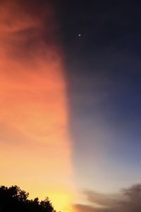 Low angle view of dramatic sky during sunset