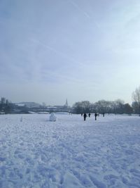 Scenic view of snow covered landscape against sky