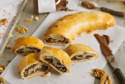 Roll with chocolate paste filling and walnuts. homemade sweet pastries