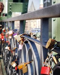 Close-up of padlocks on railing