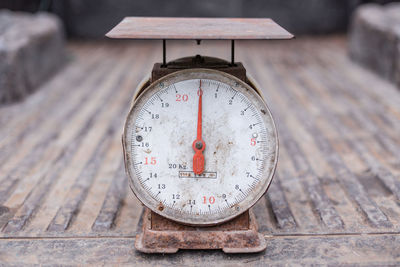 Close-up of clock on table