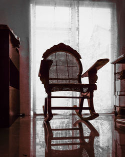 Empty chair in house