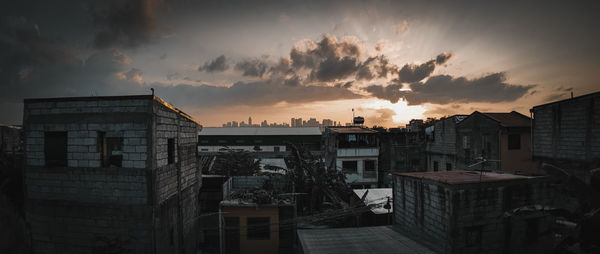 High angle view of buildings against sky during sunset