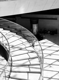 Staircase of modern building against sky in city