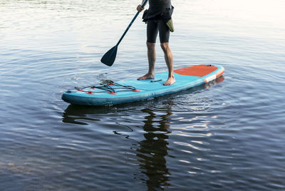 Man kayaking in sea