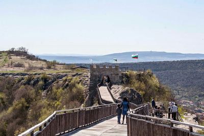 Tourists walking on mountain