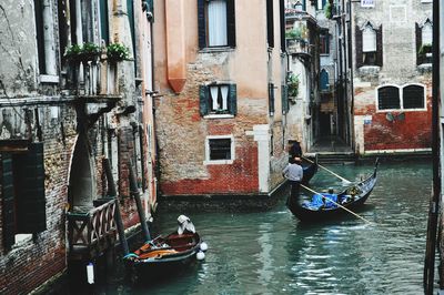 View of canal by grand canal in city of venice italy with gondolas on water renaissance buildings