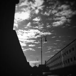 Low angle view of building against cloudy sky