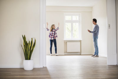 Young couple in new home discussing