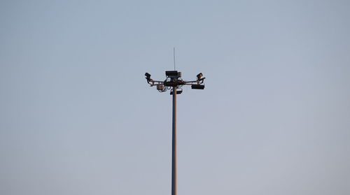 Low angle view of floodlight against clear sky