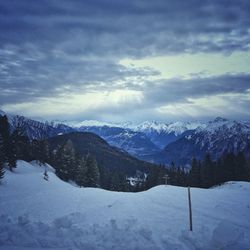 Scenic view of mountains against sky during winter
