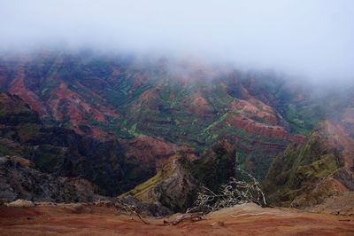 Scenic view of hawaiian canion against sky during foggy weather