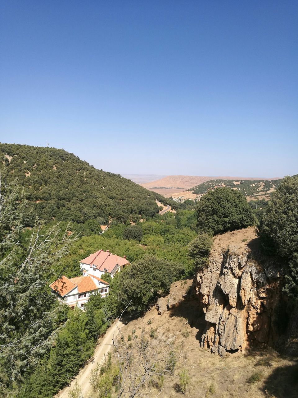 copy space, clear sky, nature, beauty in nature, house, high angle view, day, landscape, no people, built structure, outdoors, mountain, tranquility, building exterior, scenics, architecture, tree