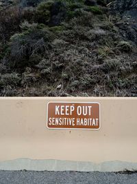 High angle view of information sign on plant
