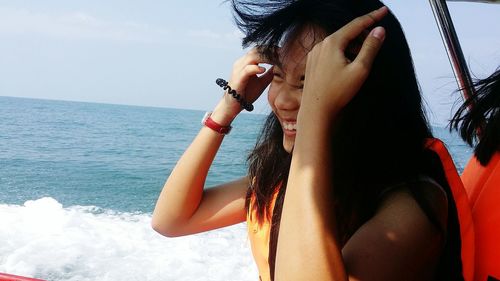 Young smiling woman on boat