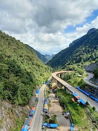 High angle view of road amidst mountains against sky