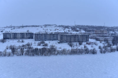 Aerial view of city against clear sky during winter