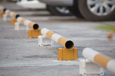 Close-up of pipes on road