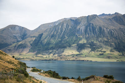 Scenic view of lake and mountains against sky