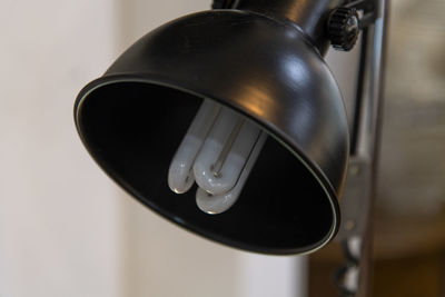 Close-up of desk lamp at home