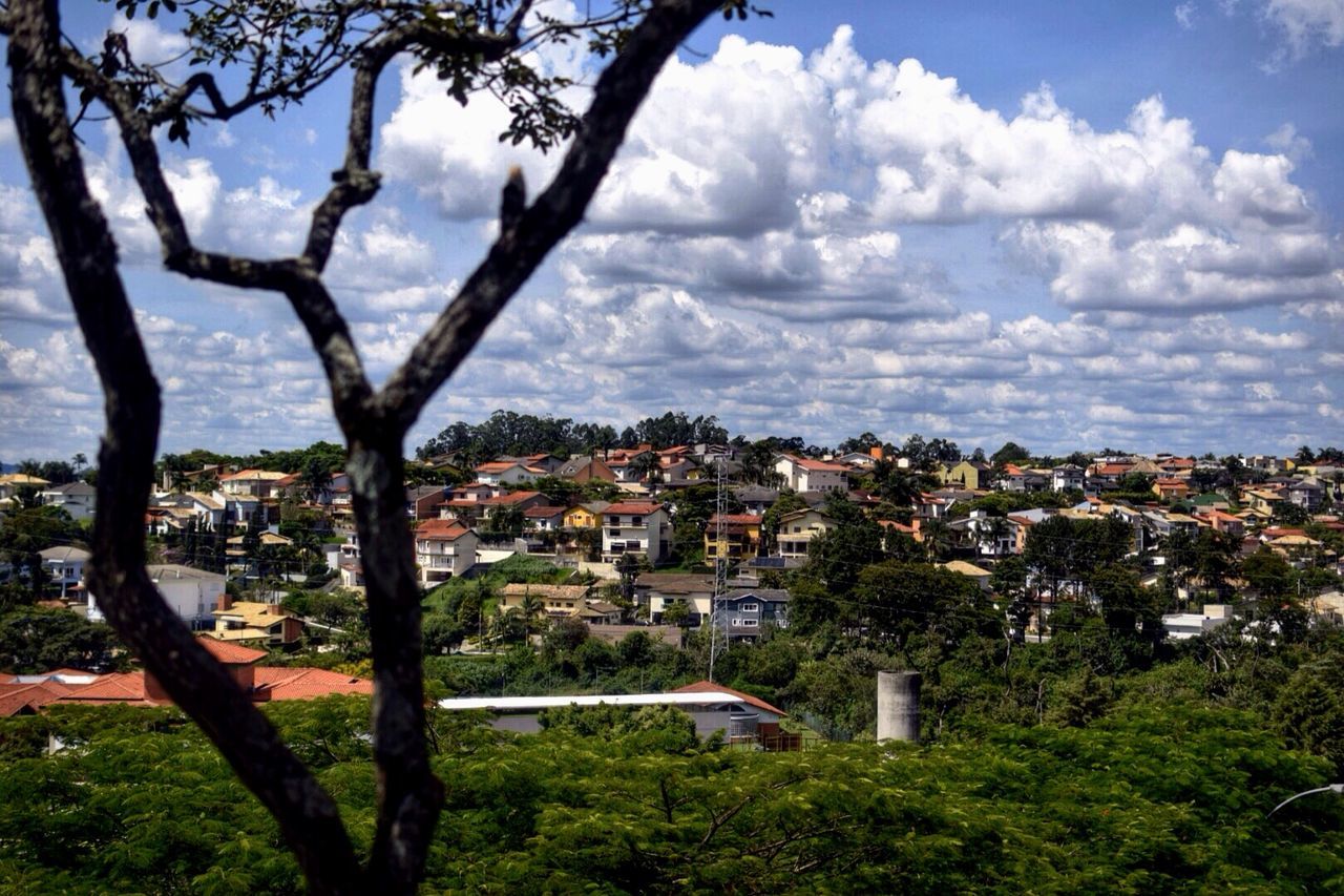 architecture, building exterior, built structure, cityscape, city, sky, crowded, tree, residential district, residential building, residential structure, high angle view, cloud - sky, town, house, townscape, cloud, day, city life, community