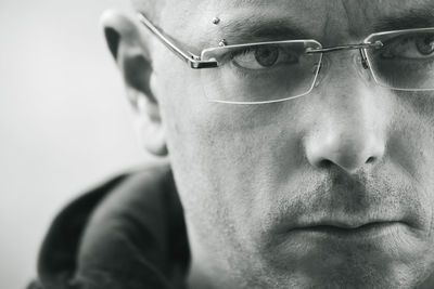 Close-up of man wearing eyeglasses