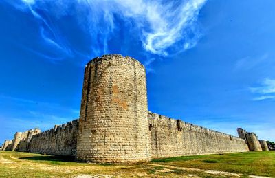 Low angle view of old ruins against sky