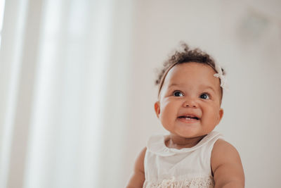 Portrait of cute baby boy at home