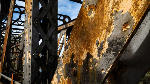 Extensive surface rust on the surface of a structural steel/iron bridge beam