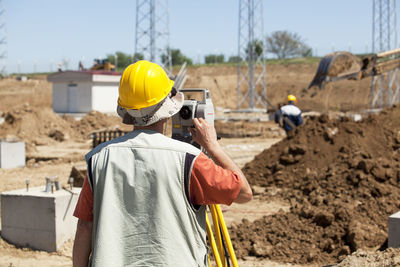 Rear view of worker at construction site
