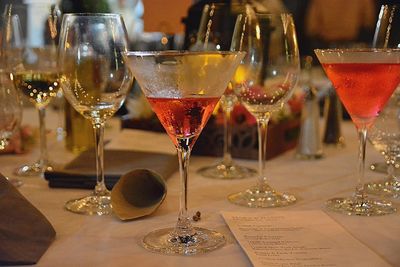 Close-up of wine glasses on table