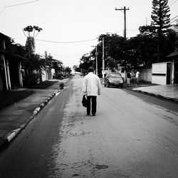 Woman walking on road