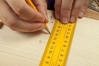 Close-up of hand on table