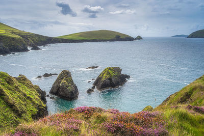 Islands at dunquin pier surrounded by turquoise water, dingle, wild atlantic way, kerry, ireland