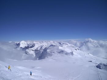 Scenic view of snow covered mountains