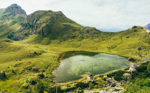 Scenic view of lake and mountains against sky