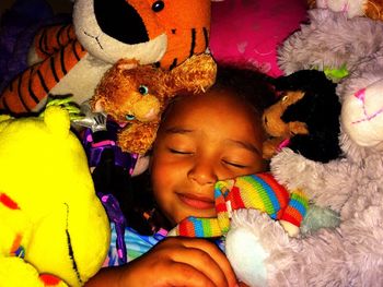 Portrait of happy girl lying on bed