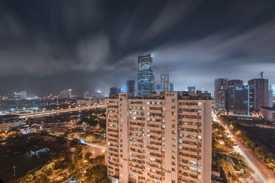 High angle view of illuminated buildings in city at night