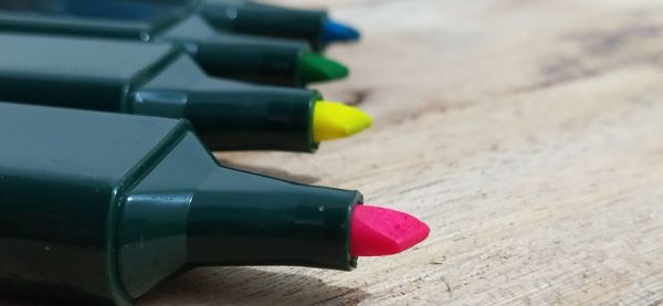 Close-up of multi colored pencils on table