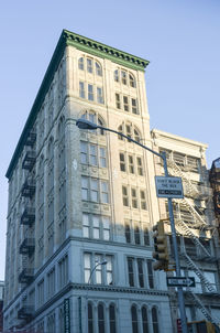 Low angle view of office building against sky