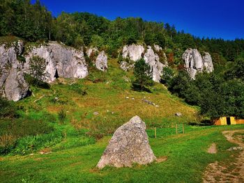 View of rocks on land against sky