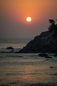 Scenic view of sea against sky during sunset