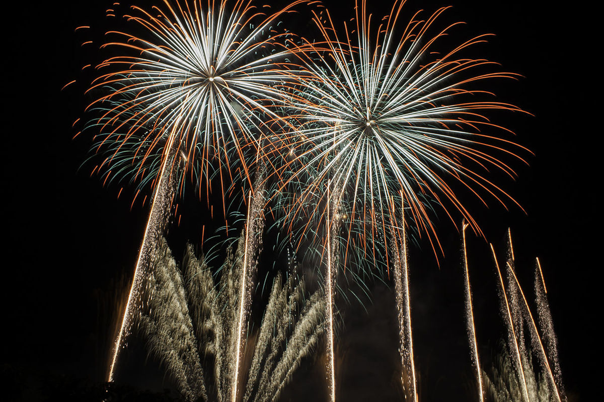 night, illuminated, firework display, celebration, exploding, firework - man made object, arts culture and entertainment, long exposure, event, low angle view, glowing, motion, sparks, firework, entertainment, blurred motion, celebration event, multi colored, sky, outdoors