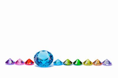 Multi colored gemstones against white background