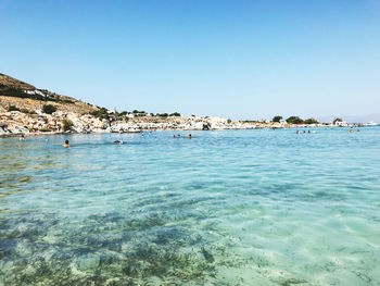 Scenic view of sea against clear blue sky