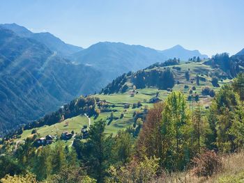 Scenic view of landscape and mountains against sky