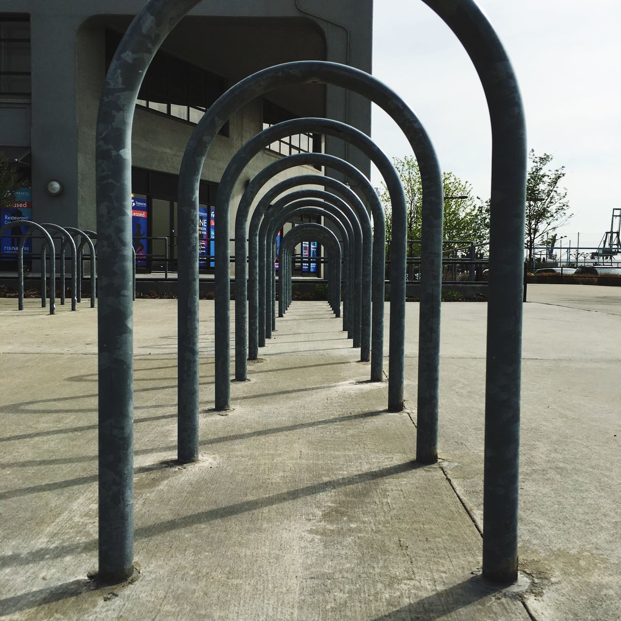 architecture, built structure, the way forward, arch, diminishing perspective, architectural column, in a row, vanishing point, empty, building exterior, column, walkway, absence, gate, day, railing, long, no people, pathway, footpath